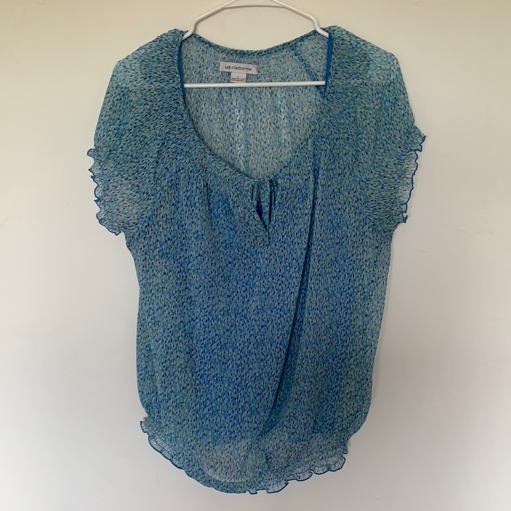Women’s lightweight blouse with tank top attached.